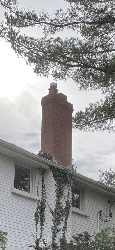 Same house with newly installed Arriscraft stone chimney showing enhanced curb appeal and craftsmanship in London Ontario