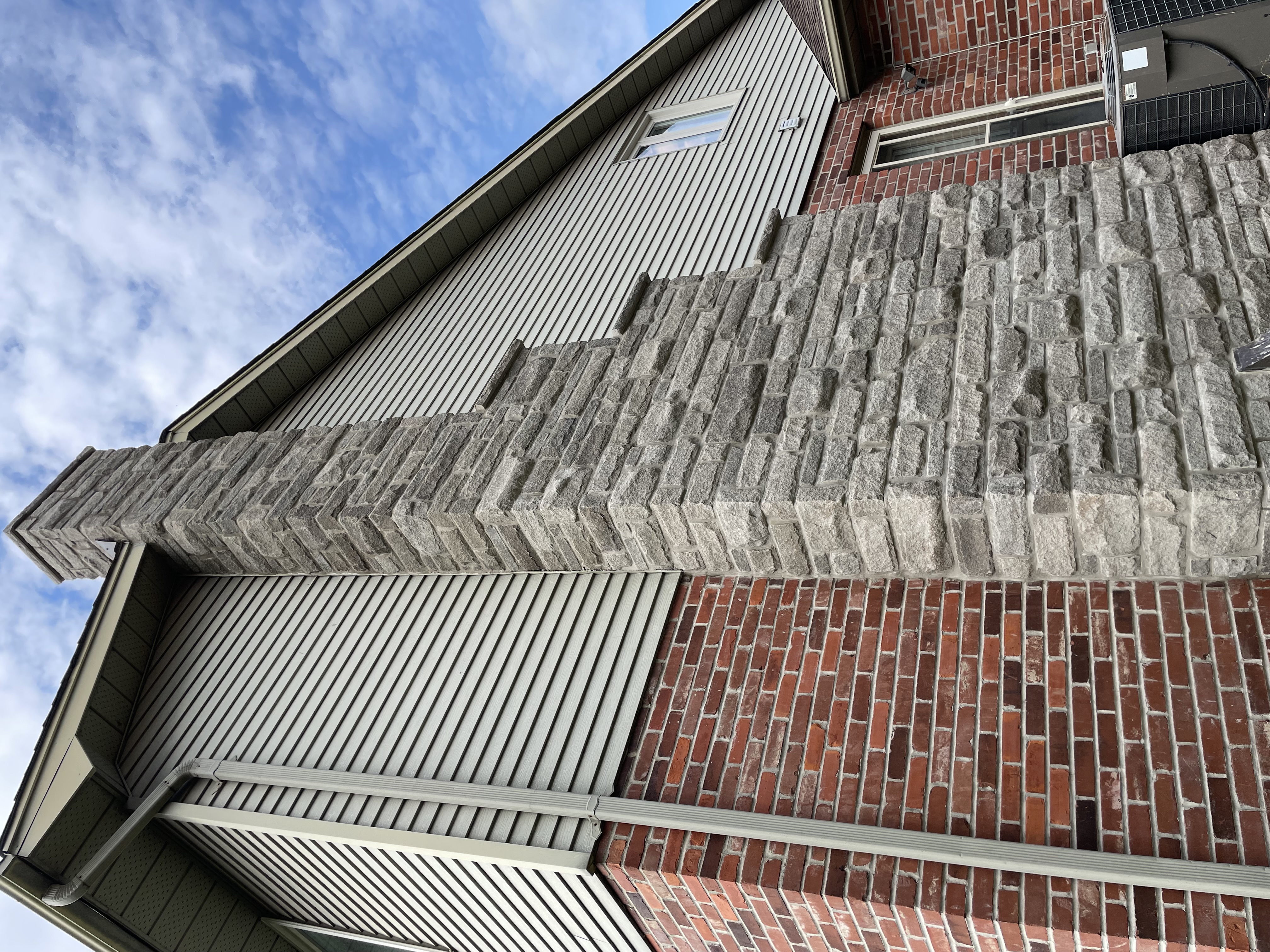 Same house with newly installed Arriscraft stone chimney showing enhanced curb appeal and craftsmanship in London Ontario