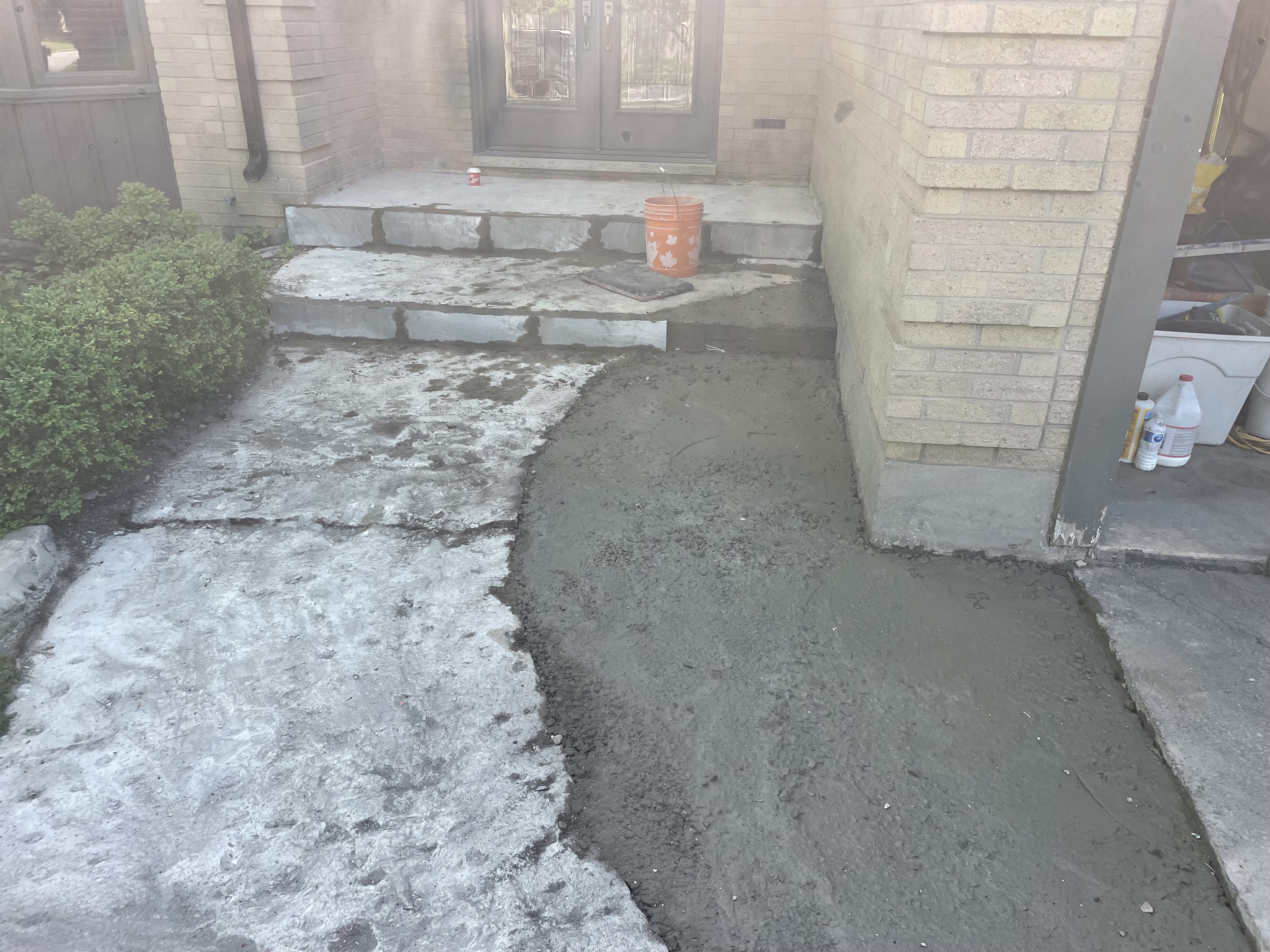 Damaged concrete walkway and porch steps before restoration in London Ontario